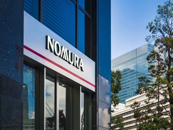 Nomura shares fall as profits drop